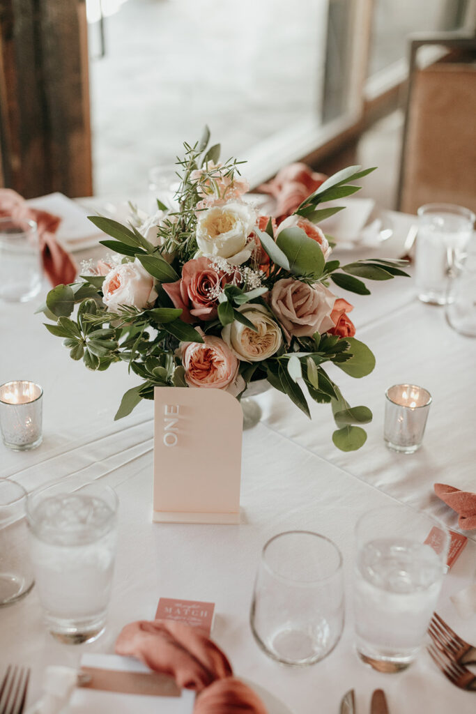 a centerpiece for the reception with chic floral design